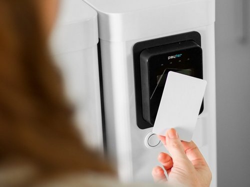 Woman holding card to card reader
